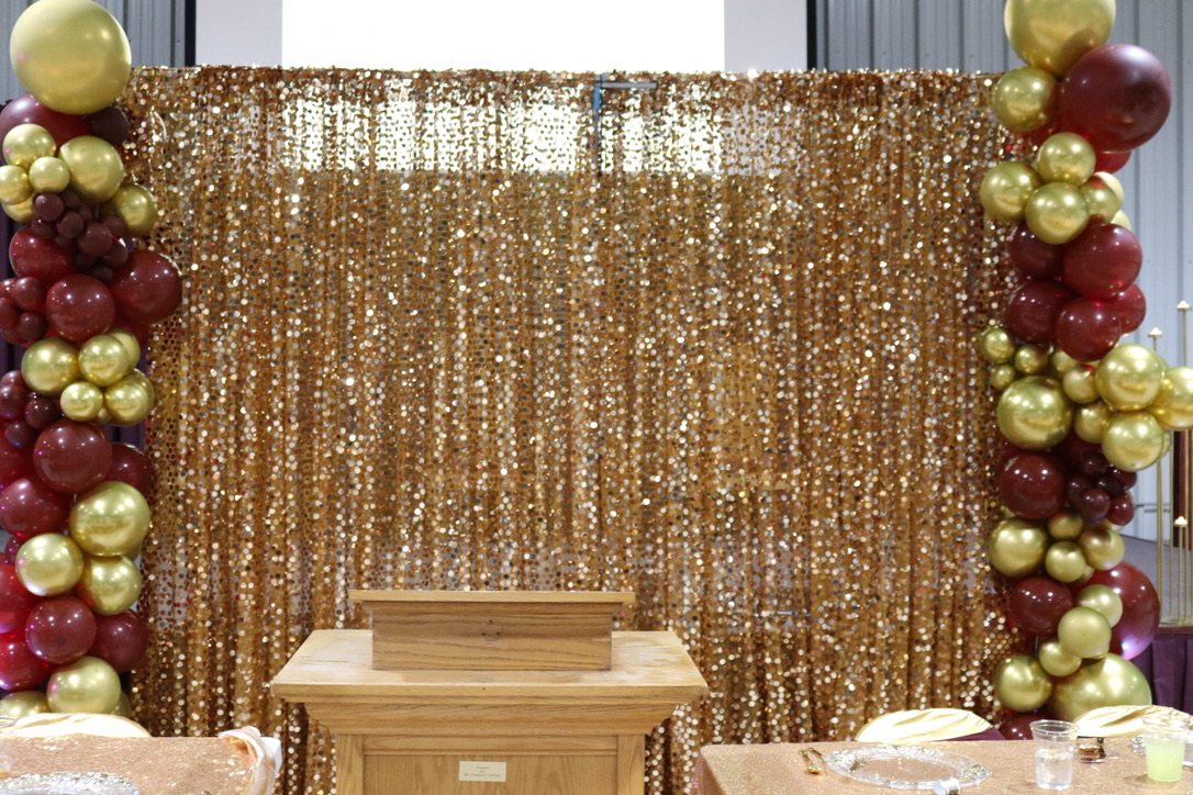 Gold sequin backdrop and balloon installation