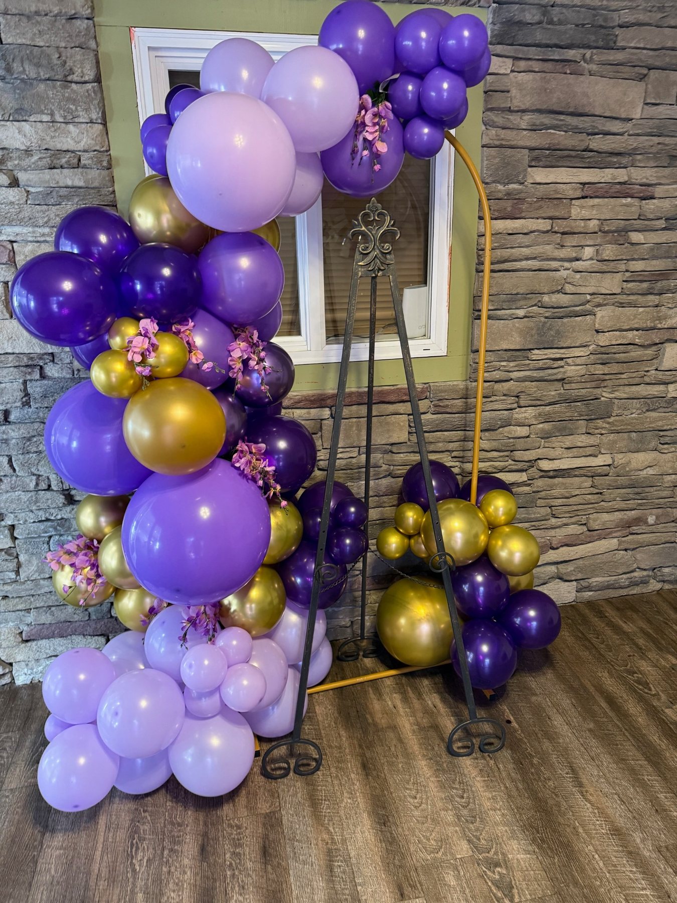 Purple and gold balloon installation